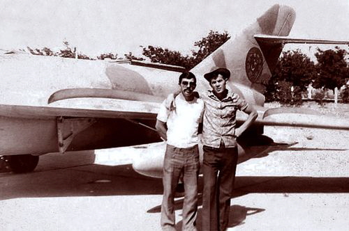 Two soviet advisers in front of afghan MiG-17  Fresco-A  with two color camouflage at Dehdadi airfield in 1979