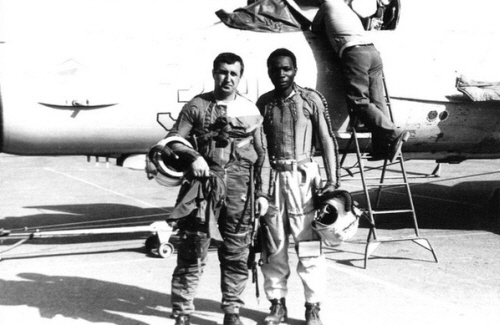 African pilot az Kant airport in front of MiG-21bis grey color