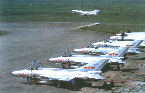 Chinese 44th Air Division’s early J-7II MiG-21 Fishbed and in front of Shenyang J-6 MiG-19 Farmer landing