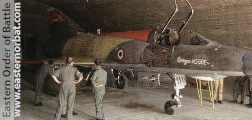 French and Egyptian ground crews inspect Egyptian Air Force Mirage 5SDE “9111” in a shelter at an unknown Air Base before a mission.