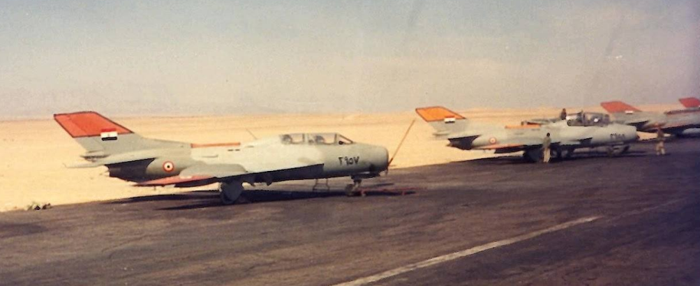 EAF Shenyang FT-6 in the nineties. It displays black-edged yellow identification panels on its tail-fin, fuselage spine and wingtips.