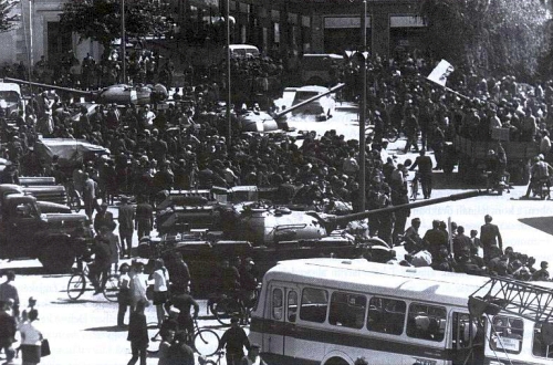 Hungarian Csepel military trucks, T-54 main battle tanks and D-442 amphibious reconnaissance vehicle with local protesters at the Érsekújvár town on August 21, 1968.