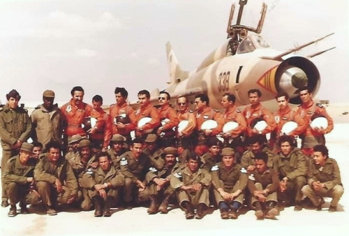 The pilots and technical crew of the Libyan 1022nd Squadron in front of their Su-22M (S-52K) 'Fitter' reconnaissance bomber at Ghardabiya airbase in 1986. The Su-22M aircraft with tactical number black 338 still bears its factory sand-brown and green camouflage paint, which has faded slightly under the North African sun.